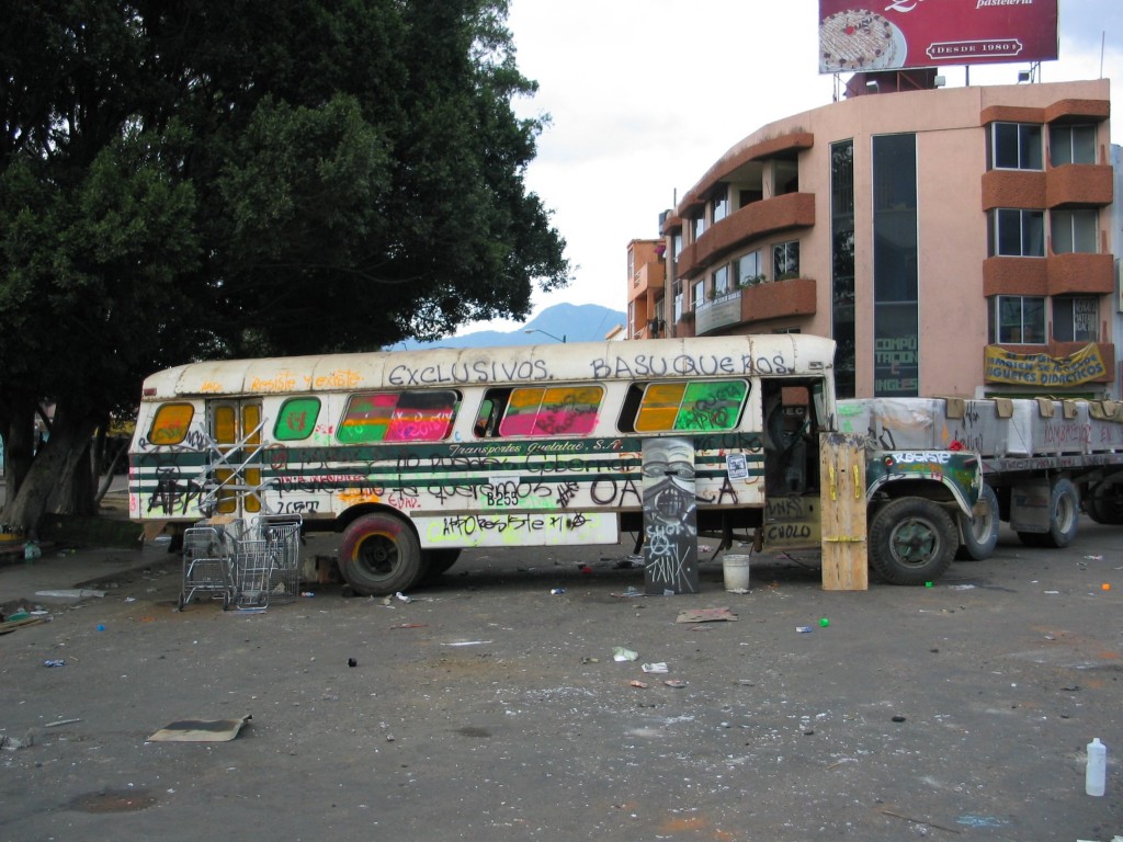 A bus serving as a road block for the protesters.